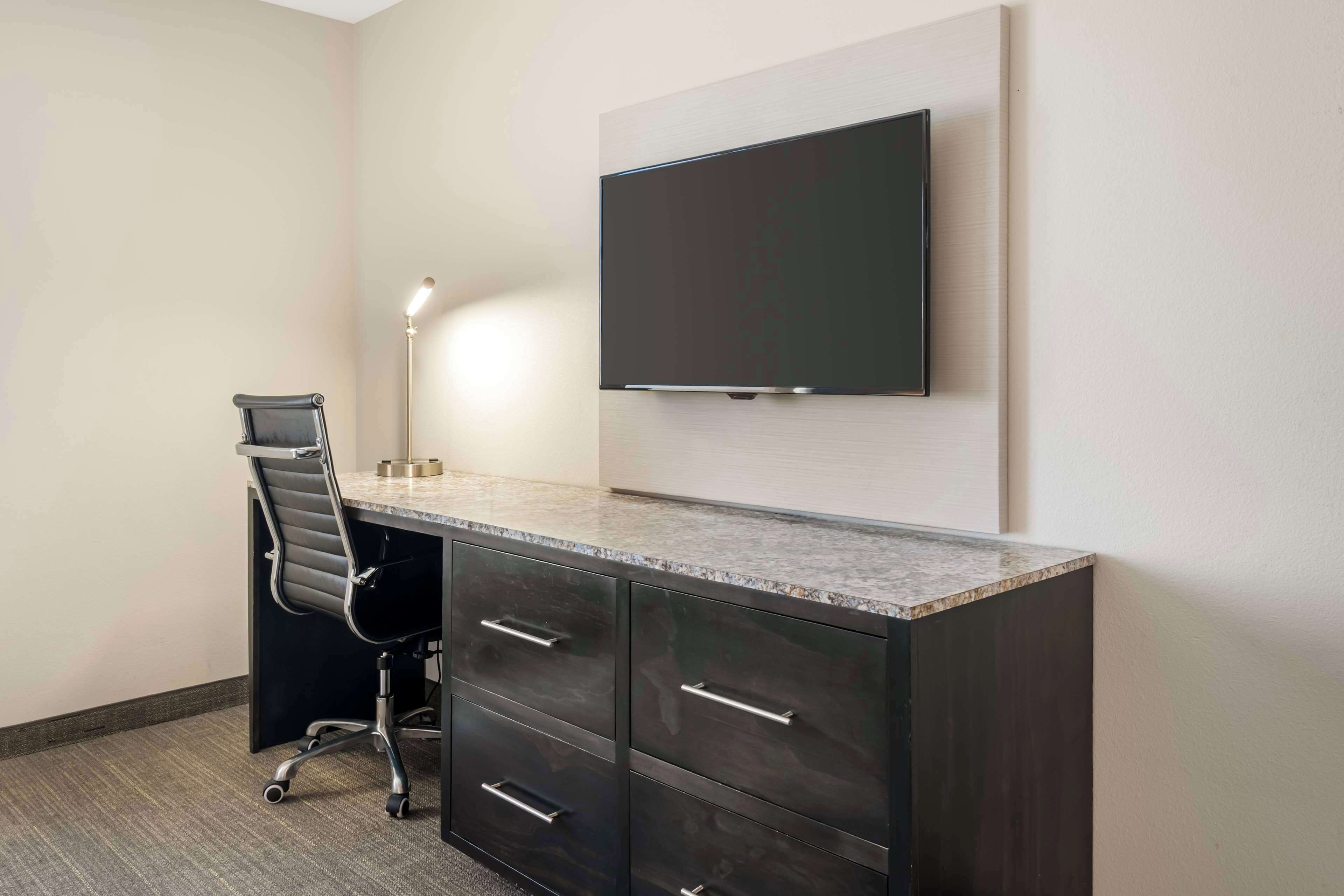 premium bedding, desk, laptop workspace, blackout curtains