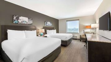 Premium bedding, desk, laptop workspace, blackout curtains