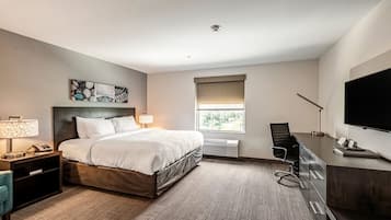 Premium bedding, desk, laptop workspace, blackout drapes