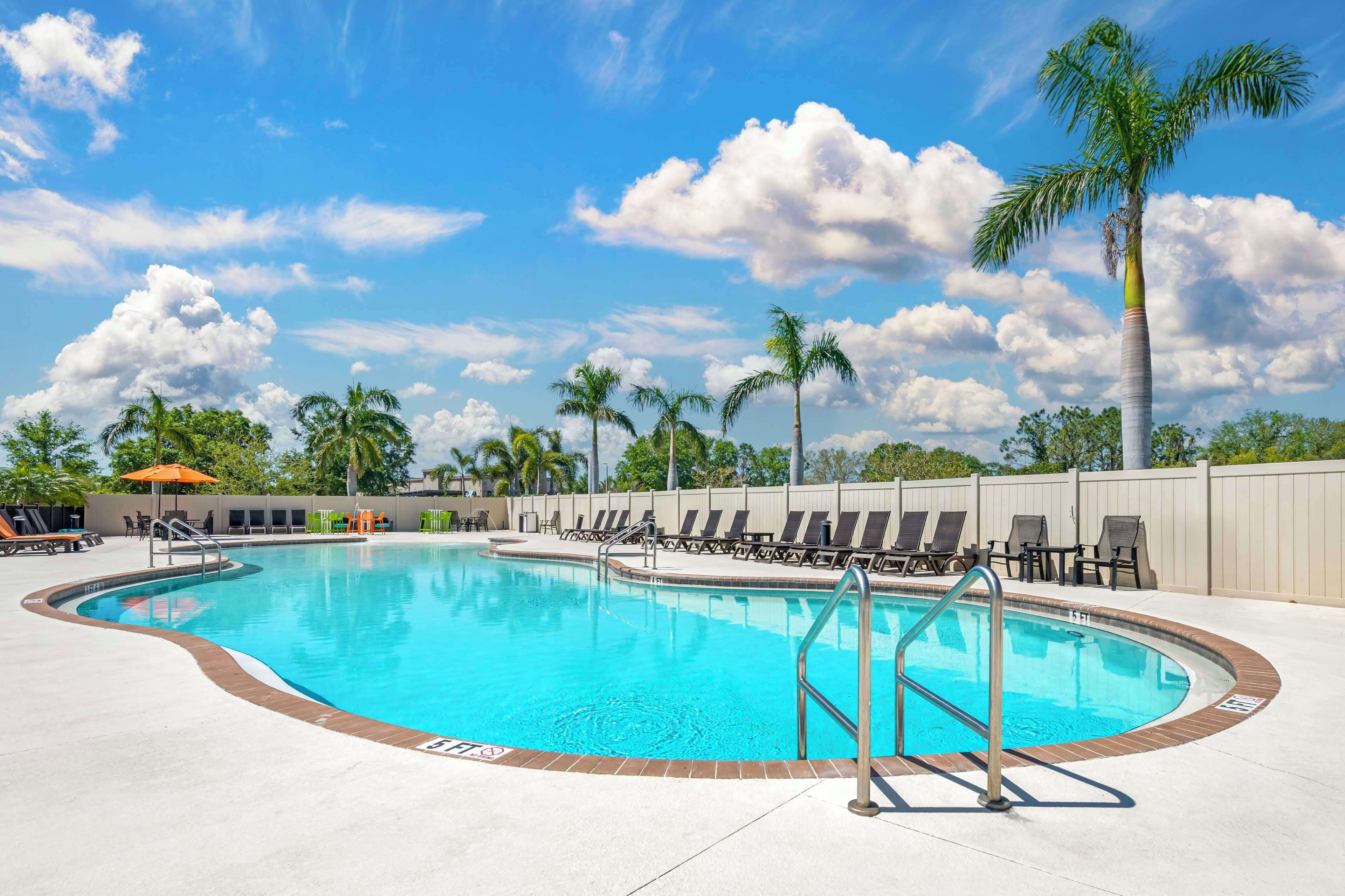 outdoor pool, pool umbrellas, pool loungers