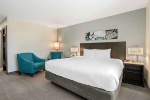 Premium bedding, desk, laptop workspace, blackout curtains