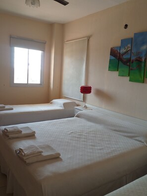 Standard Quadruple Room, 1 Bedroom, Non Smoking, Private Bathroom (Lirios) | Free WiFi, bed sheets - Vista del Sol B&B (Pinto)
