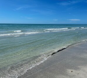 A beach with clear water, a sandy shore, and a clear sky. - BeachHouse Bungalow 🏝Spacious One Level Single Family  Home🏖Walk to the Beach! (Redington Beach)