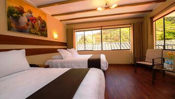 A hotel room with two beds, a large window with a view, a painting on the wall, and a table with a chair.