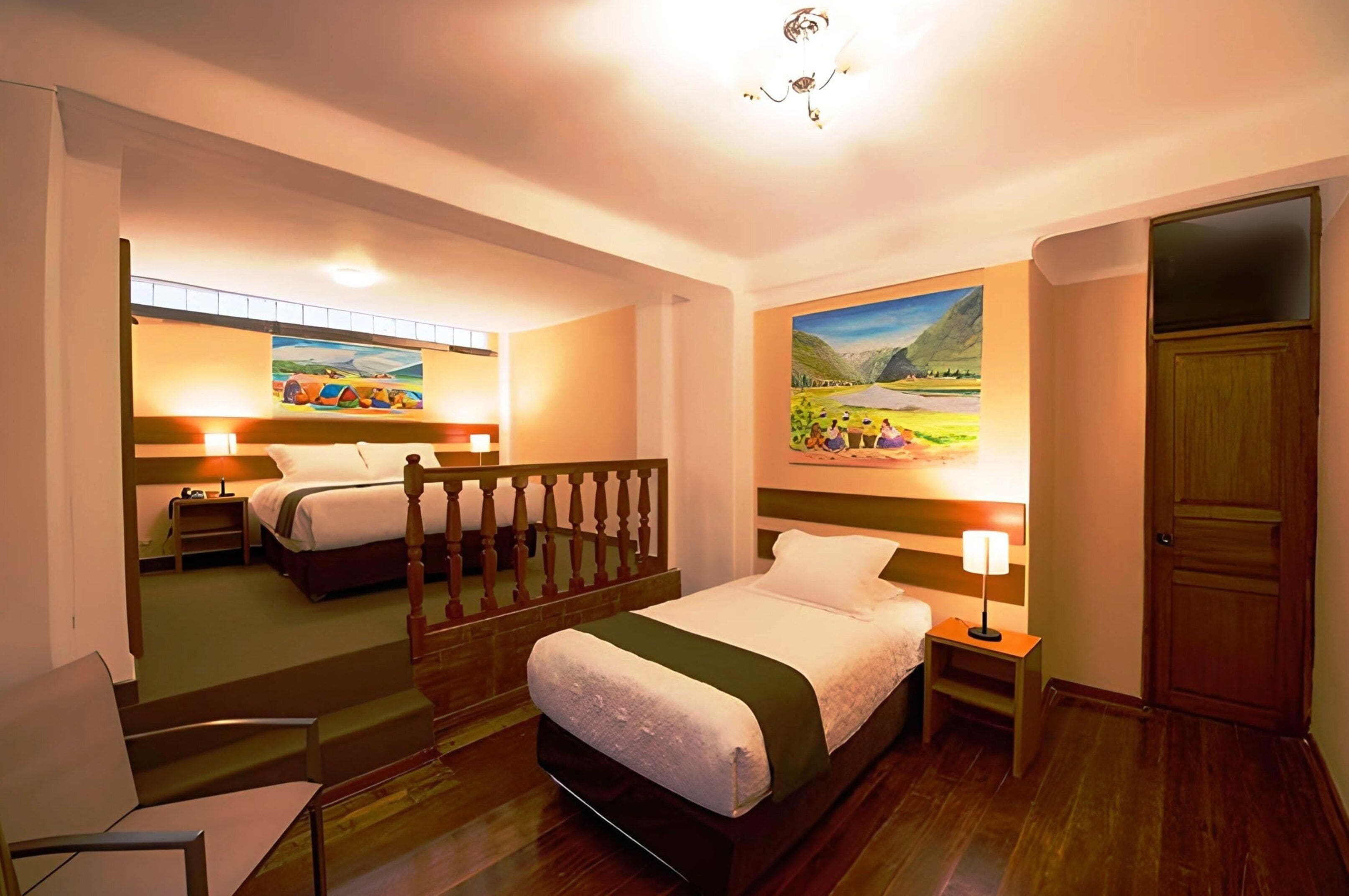 A hotel room with a bed, a chair, a nightstand, a painting, and a door.