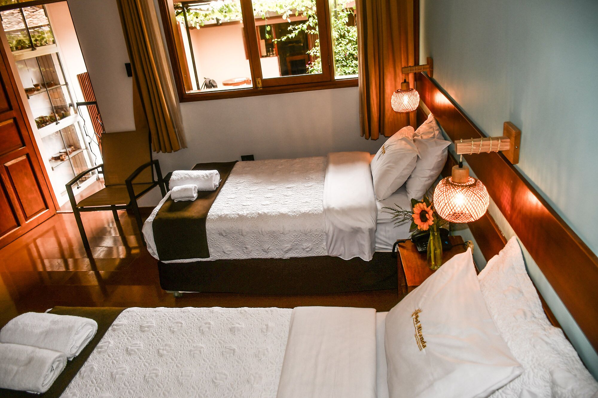 Premium bedding, down comforters, Tempur-Pedic beds, desk