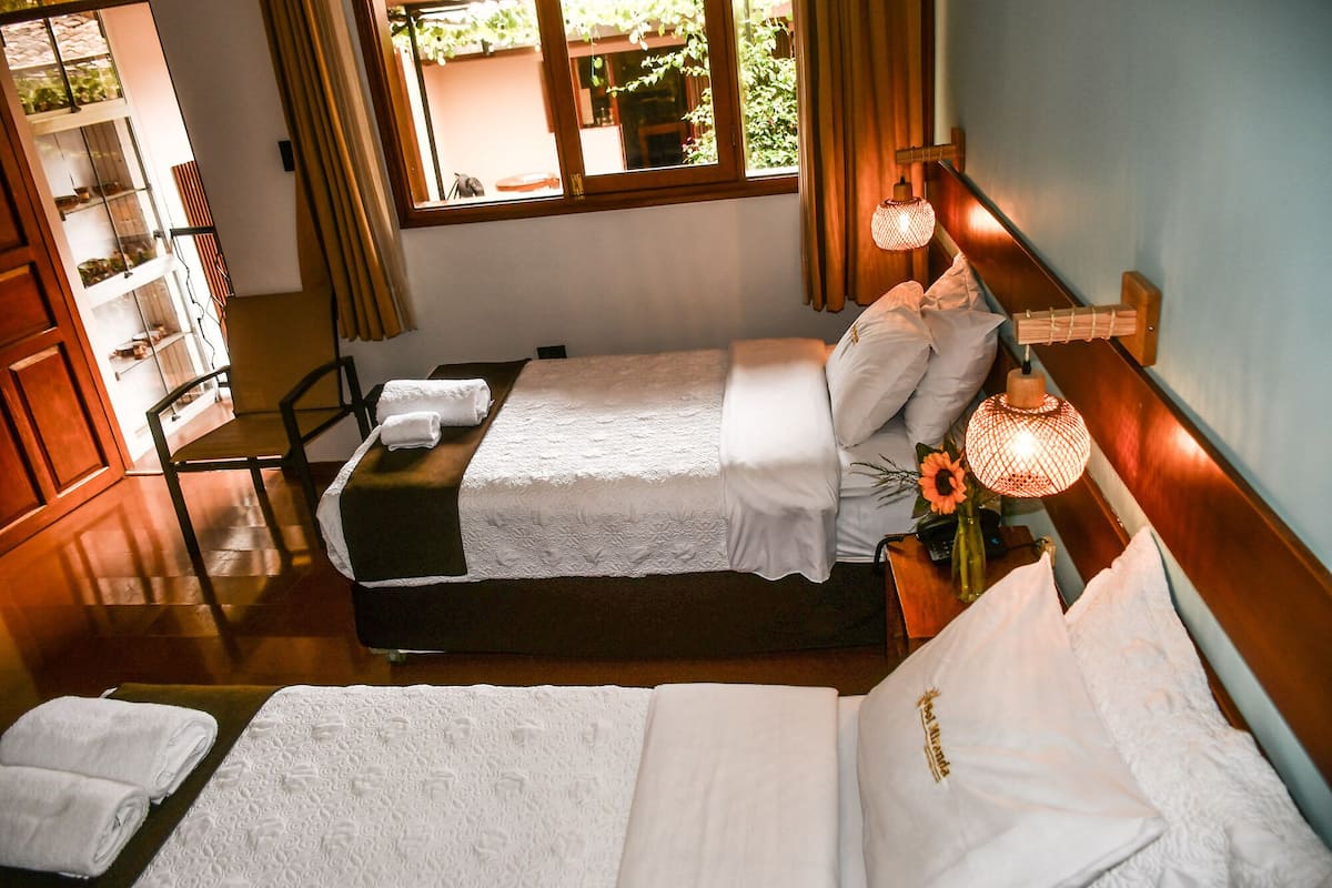 Premium bedding, down comforters, Tempur-Pedic beds, desk