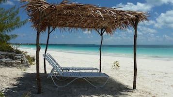 On the beach, sun loungers, beach towels