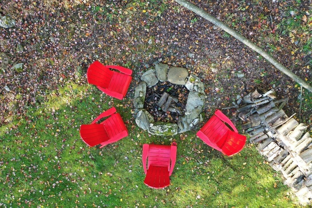 Firepit with Adirondack chairs.