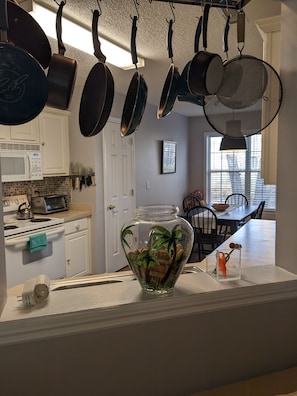 Enjoy cooking in this well-equipped kitchen with a stove, microwave, toaster oven, and ample counter space.