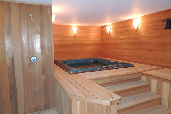 Relax in the comfort of a private, indoor hot tub in a cedar lined spa