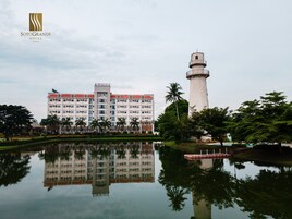 A hotel with a large building and a lighthouse.