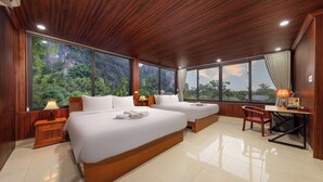A spacious bedroom with two large beds, wooden headboards, and a large window offering a view of a mountainous landscape. - Tam Coc Eco Field Homes (Nam Hoa Lu)