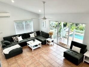House, 5 Bedrooms, Non Smoking, Park View | Living area | 55-inch flat-screen TV with cable channels, Smart TV, video game console - Pura Vida (Noosaville)