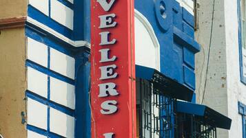 A building with a sign that reads "TRAVELERS INN".