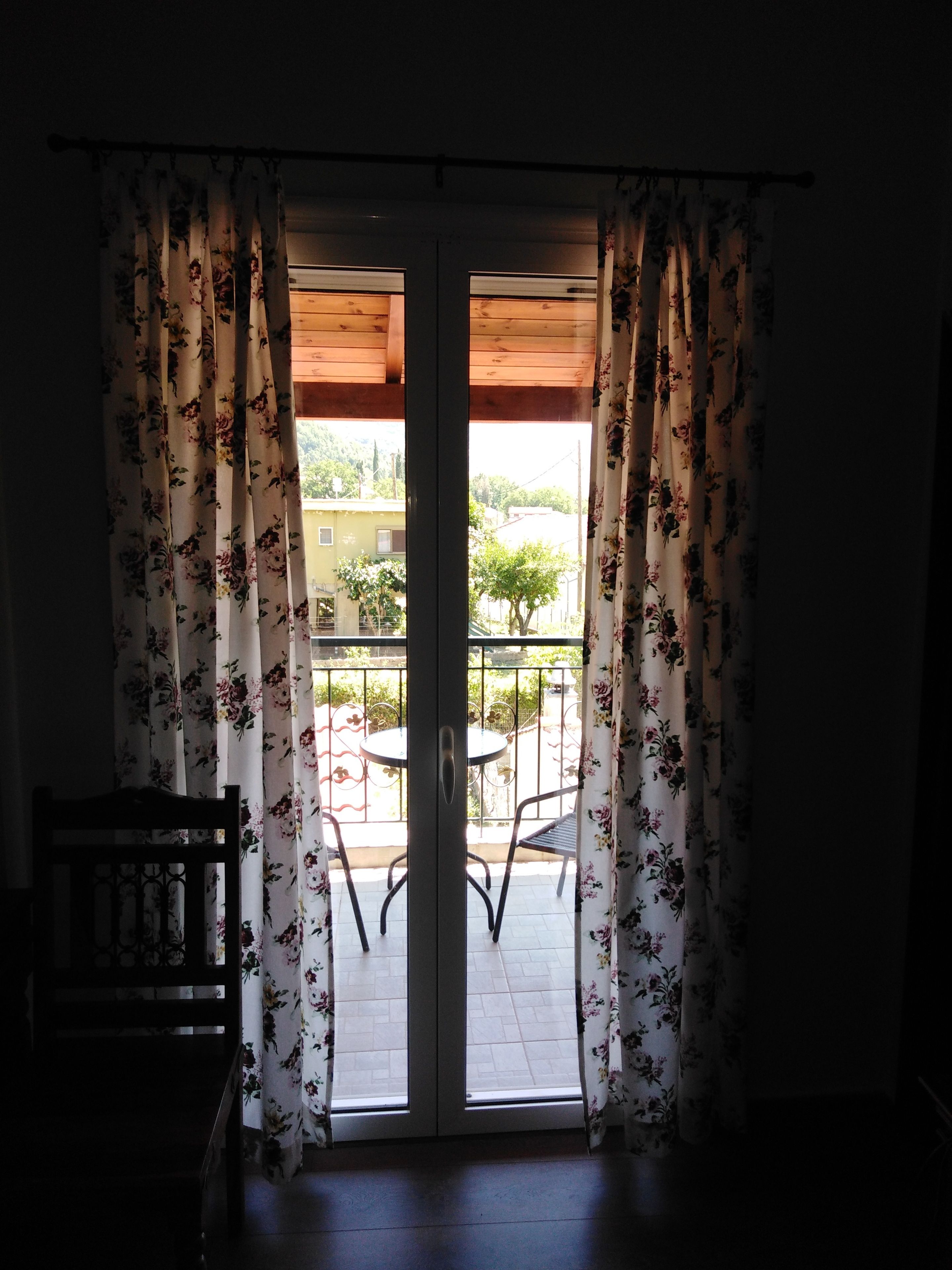 A room with a sliding glass door leading to an outdoor patio area.
