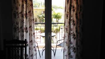 A room with a sliding glass door leading to an outdoor patio area.