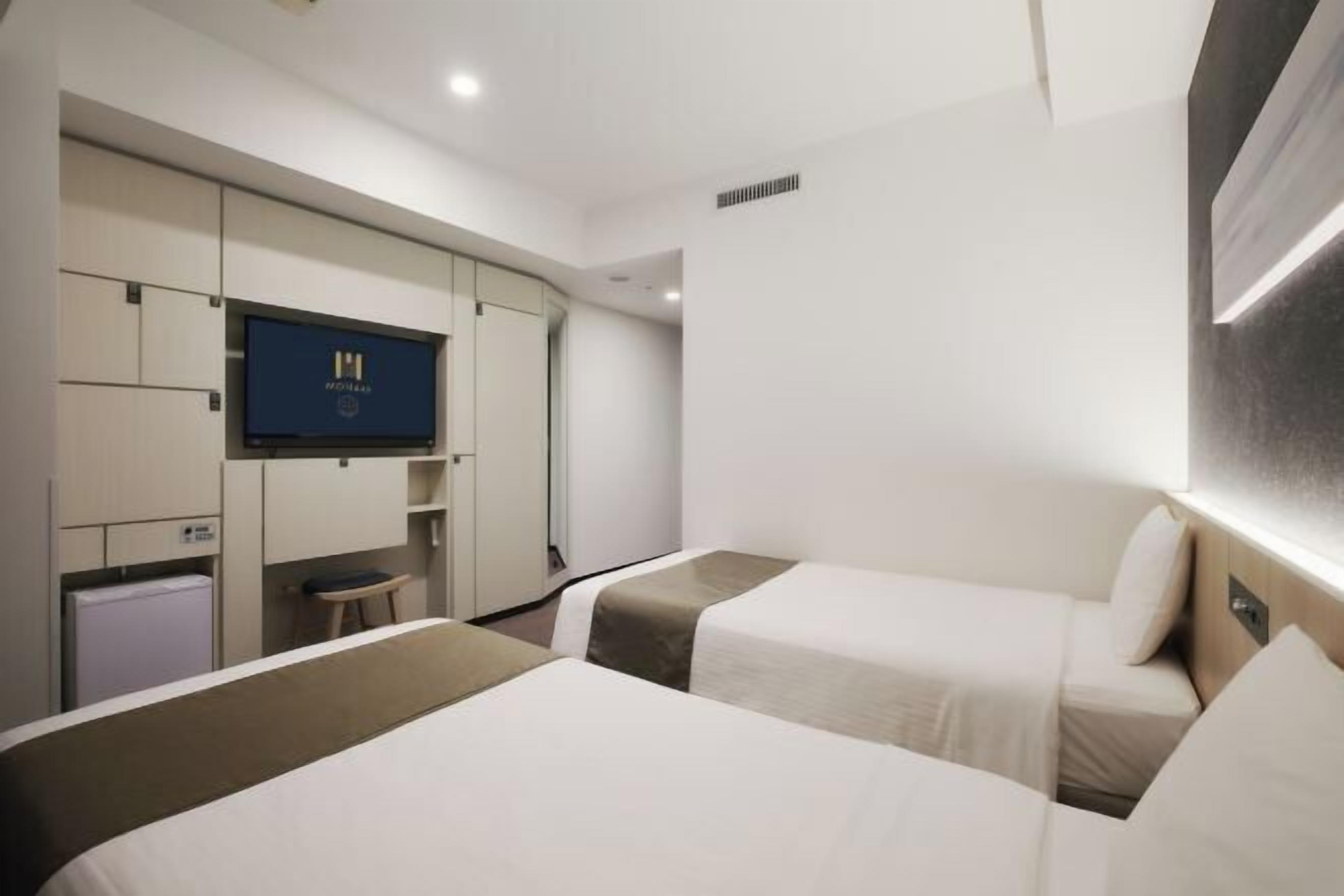 خزنة داخل الغرفة وستائر تعتيم وواي فاي مجانًا وملاءات أسرّة