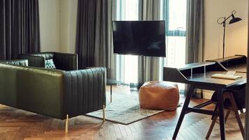 Lacasa Suite | Living area | Flat-screen TV, iPod dock