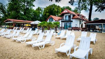 On the beach, sun loungers, beach volleyball, beach bar