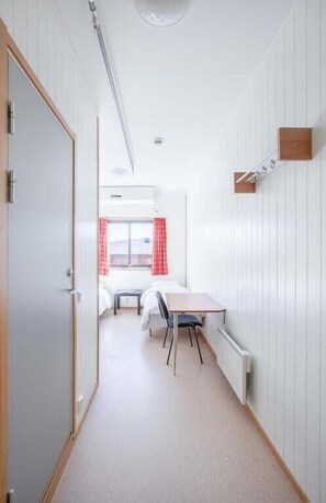 Desk, laptop workspace, free WiFi, bed sheets