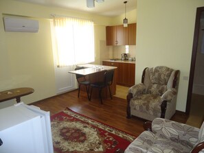 Familienapartment | Wohnbereich | Flachbildfernseher