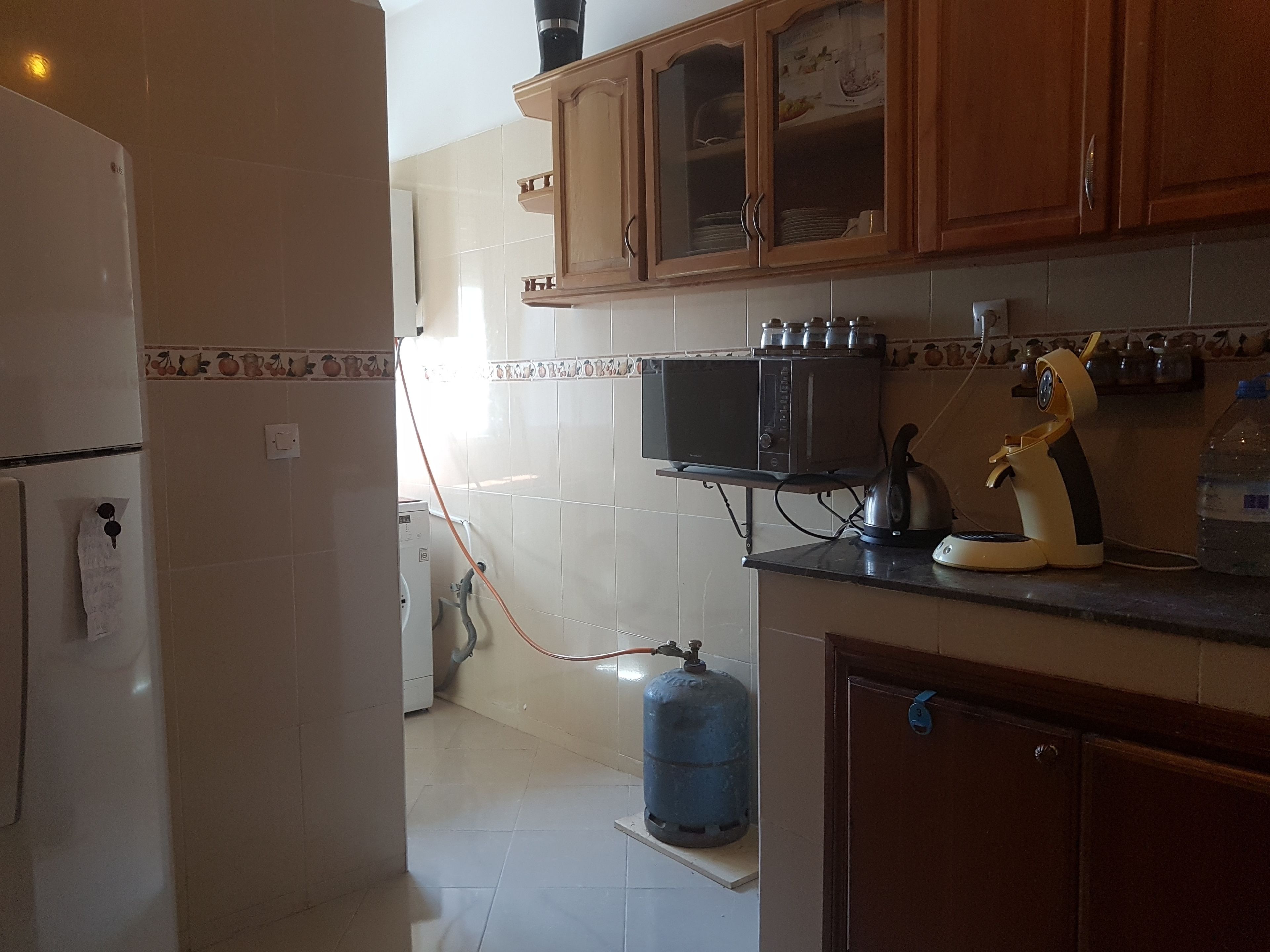 Fridge, microwave, stovetop, cookware/dishes/utensils