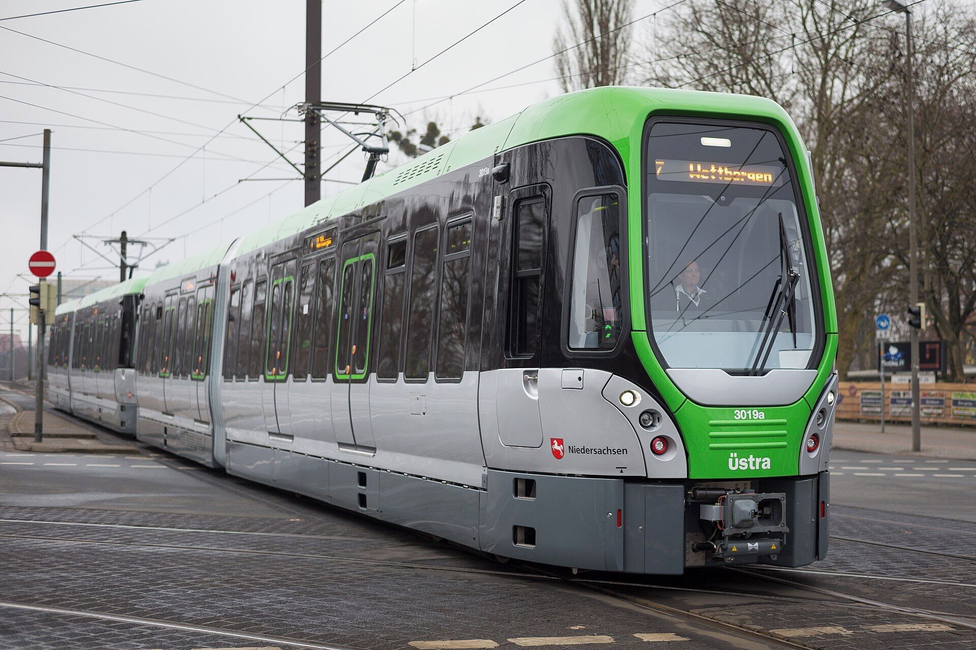 A modern tram with "Niedersachsen" and "Ustra" branding, indicating it's part of a public transportation system.