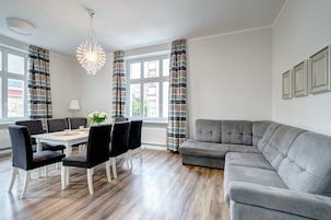 Deluxe Apartment (10 occupants ) | Living room | 55-inch flat-screen TV with cable channels, TV
