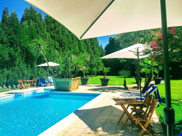 Outdoor pool, pool umbrellas, pool loungers