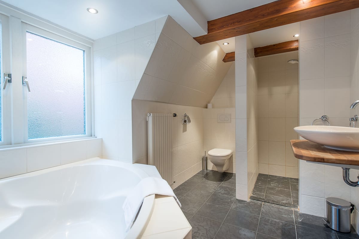 shower, deep-soaking bathtub, designer toiletries, hair dryer