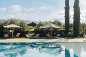 Indoor pool, seasonal outdoor pool, pool umbrellas, pool loungers