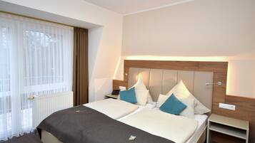 Hypo-allergenic bedding, down comforters, desk, blackout drapes