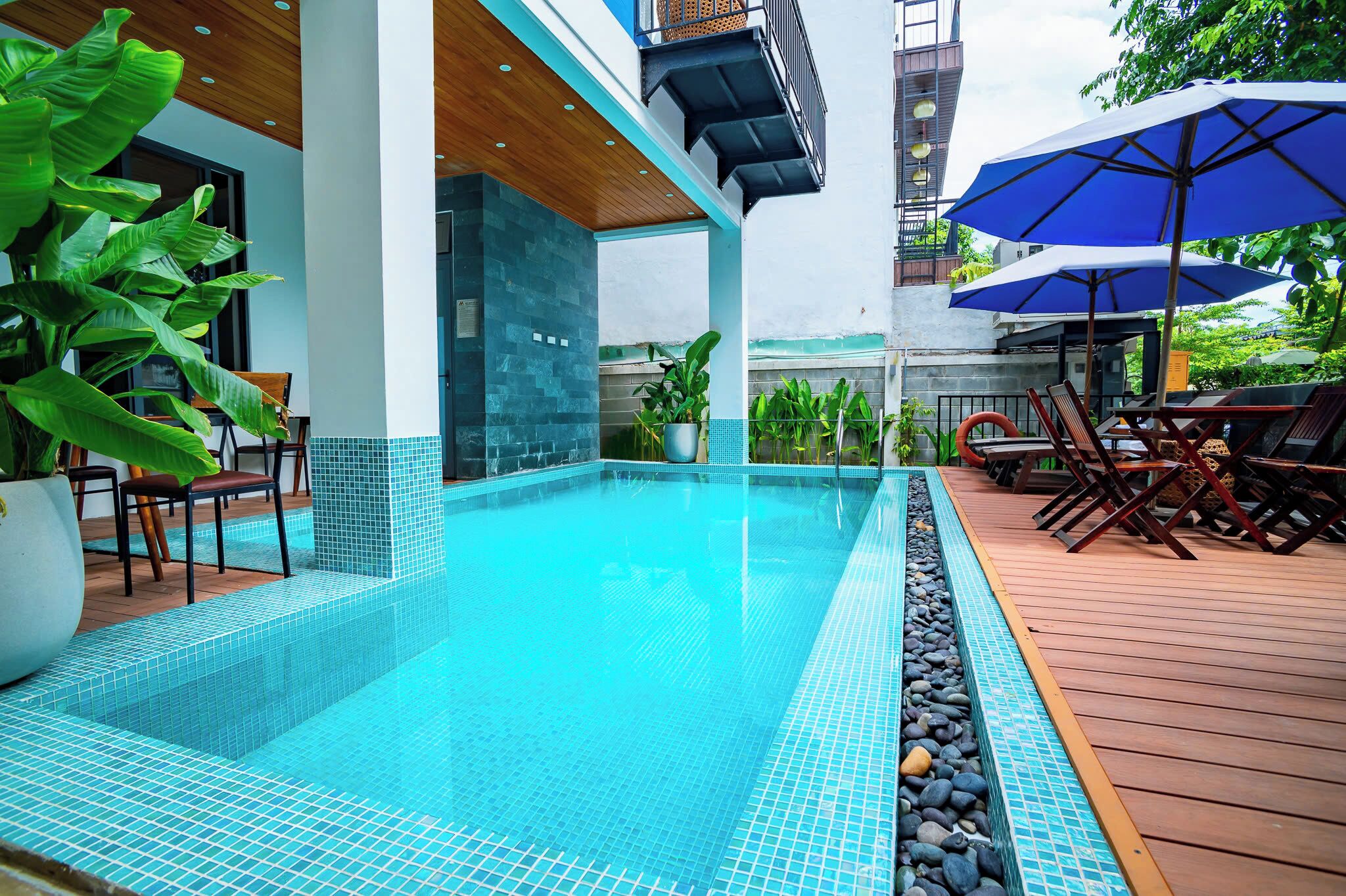 outdoor pool, pool umbrellas, pool loungers