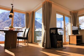 Deluxe Apartment, 1 Bedroom, Mountain View, Mountainside | Living area | 48-inch plasma TV with satellite channels, TV, DVD player - Engadin Lodge (Samnaun)