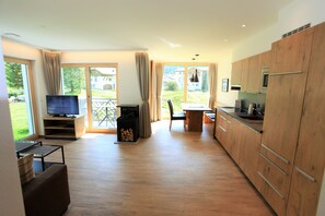 Deluxe Apartment, 1 Bedroom, Mountain View, Mountainside | Living area | 48-inch plasma TV with satellite channels, TV, DVD player - Engadin Lodge (Samnaun)