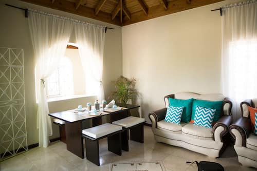 Family Apartment, 2 Bedrooms | Living area | 50-inch flat-screen TV with cable channels, TV, DVD player