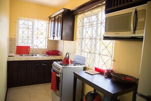 Family Apartment, 2 Bedrooms | Private kitchen | Full-size fridge, microwave, oven, stovetop - Apartment in Hellshire near Beach (Hellshire)