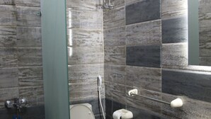 A modern bathroom with a toilet, bidet, and sink. - Australian Deluxe Hostel (Cairo)