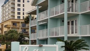 A multi-story hotel with a light blue exterior and a sign that reads "Gulfview". - Private Beach & Free Beach Service; Walkable Scenic 98 to Dining; Pool & Hot Tub (Miramar Beach)