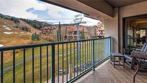 A balcony with a view of a mountainous area and buildings. - Plaza 403 (Telluride)