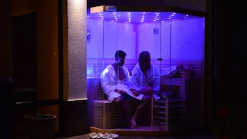 Relax in a sauna with a bench and table for comfort.