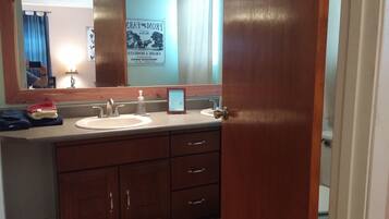 Bathtub, eco-friendly toiletries, hair dryer, towels