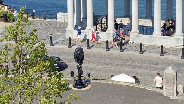 A waterfront promenade with a classical building featuring columns, surrounded by a marina with various boats. - Beautifully Renovated Downtown Luxury Condo, a block from the rock!   (Plymouth)