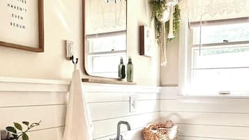 Combined shower/tub, hair dryer, towels, soap