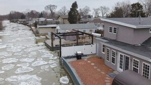 A residential area with houses along a river covered in ice. - Water Front, Cedar Island Marina, Beach, Wineries, New HVAC, Newly Renovated (Kingsville)