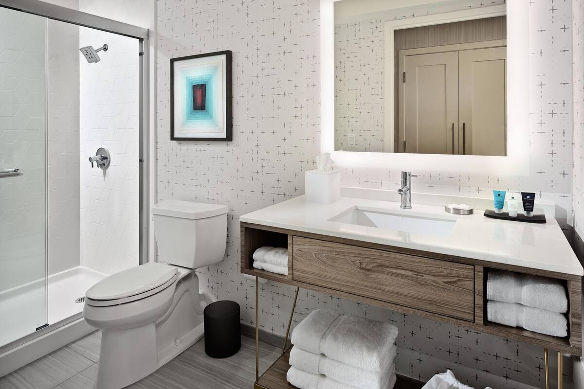 combined shower/bathtub, rainfall showerhead, designer toiletries