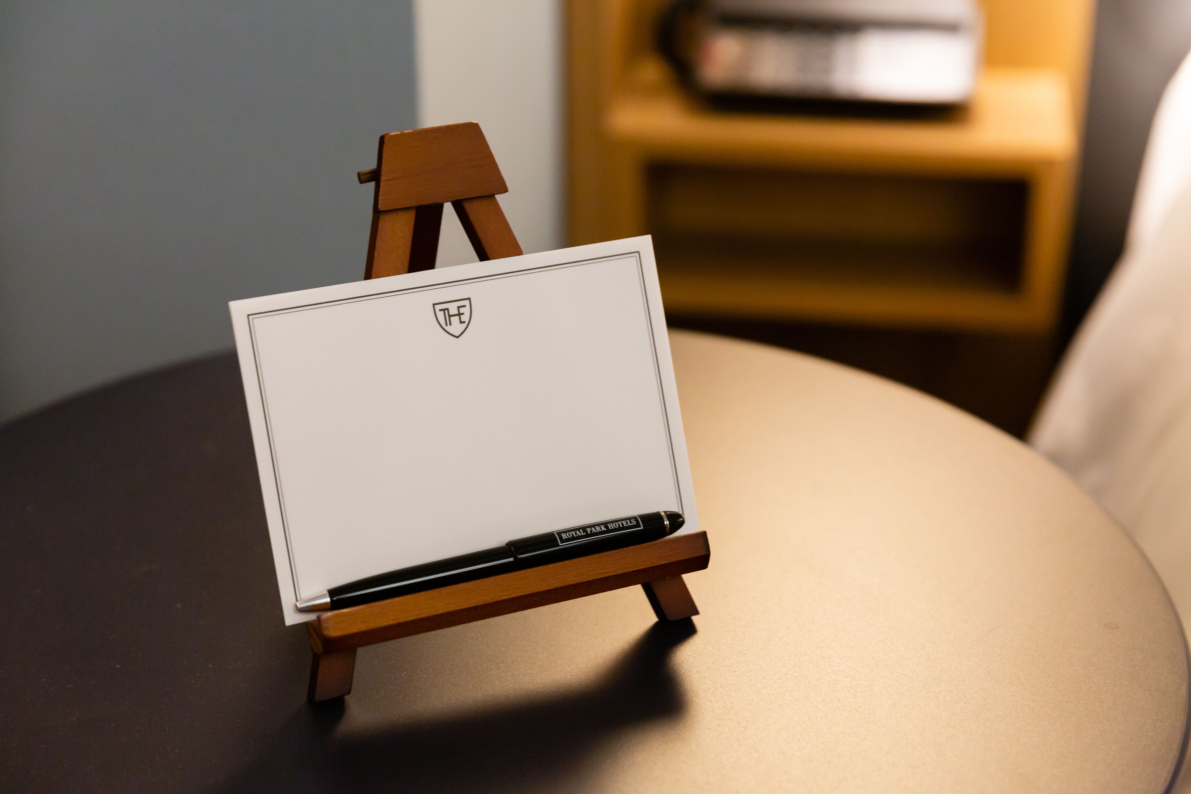 A small easel with a whiteboard on a table.