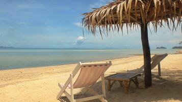On the beach, sun-loungers, beach umbrellas, beach massages