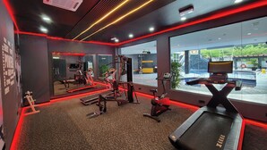A gym with treadmills, weight machines, and a mirrored wall. - De Palma Hotel Shah Alam (Shah Alam)